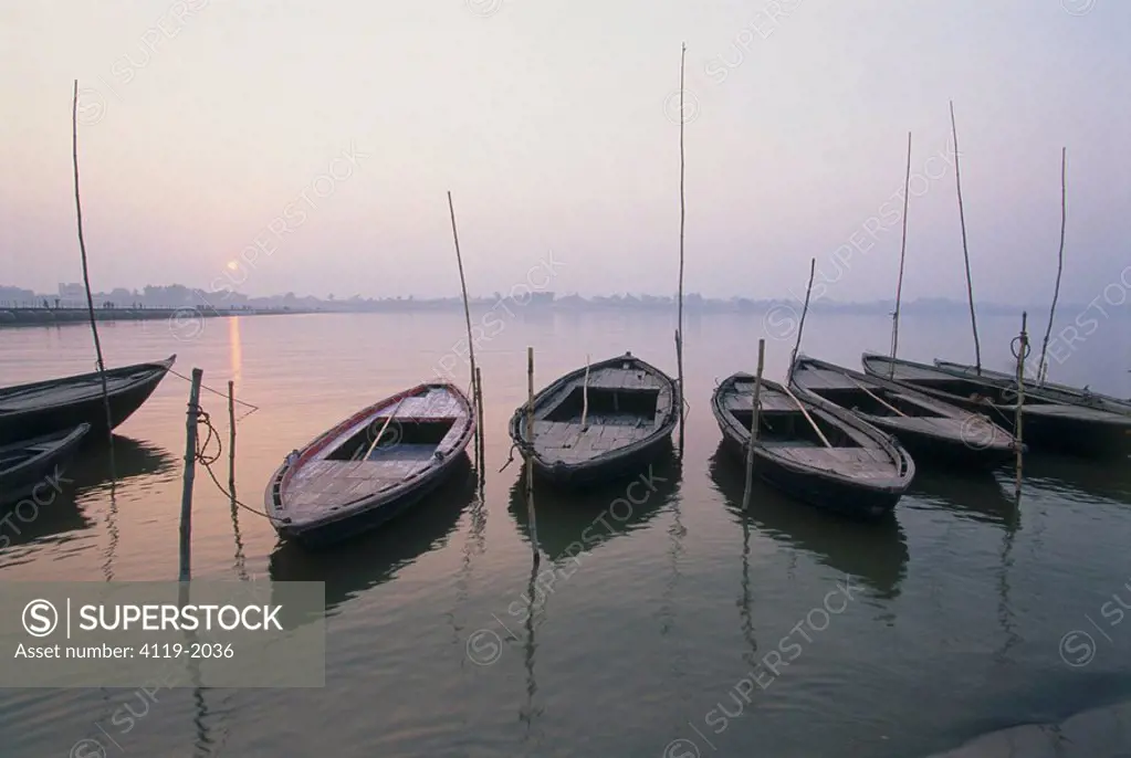 Photograph of wooden boats on a river in India