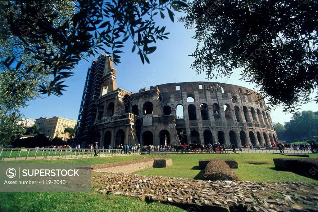 Photograph of the ruins of the Roman Coliseum in the modern city of Rome
