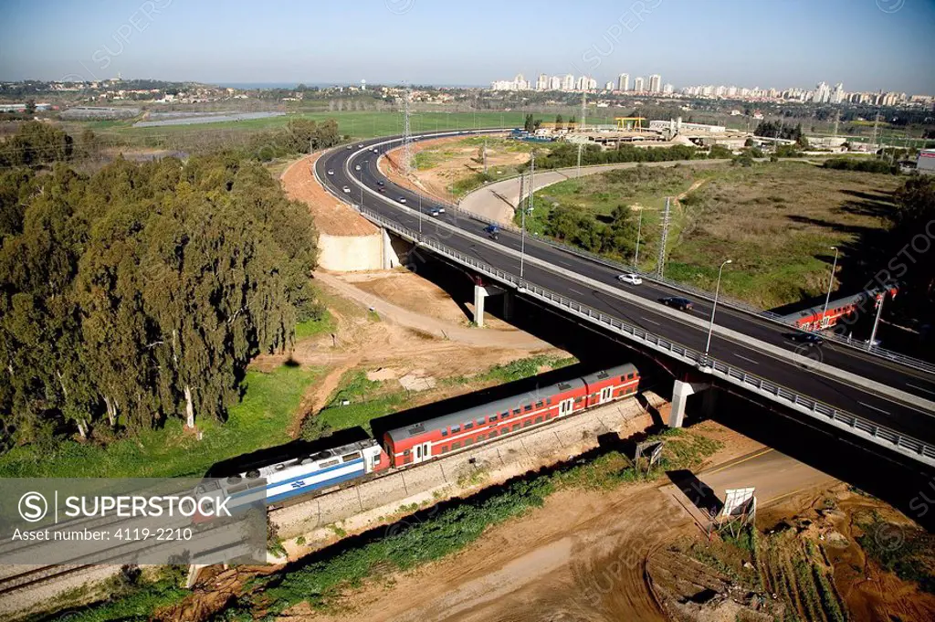 Aerial photograph of a train passing under a bridge near the village of Beit Yehoshua in the Sharon