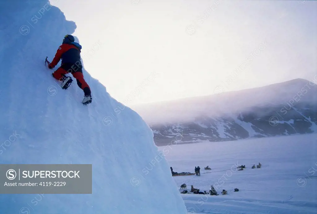 Image of a man climbing an ice wall at the Baffin island