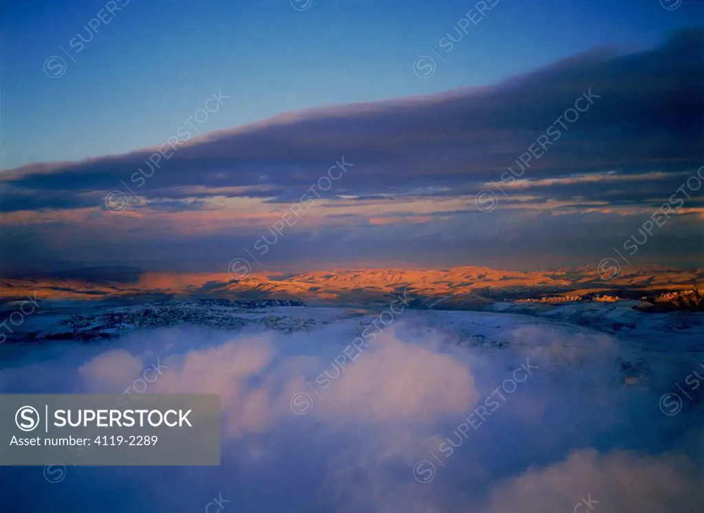 Aerial view of the Judea desert over clouds after a storm
