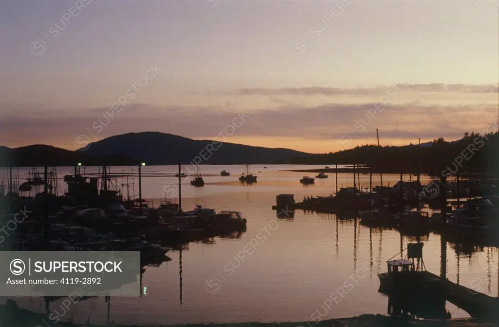 Photograph of a small harbor in Alska at sunset