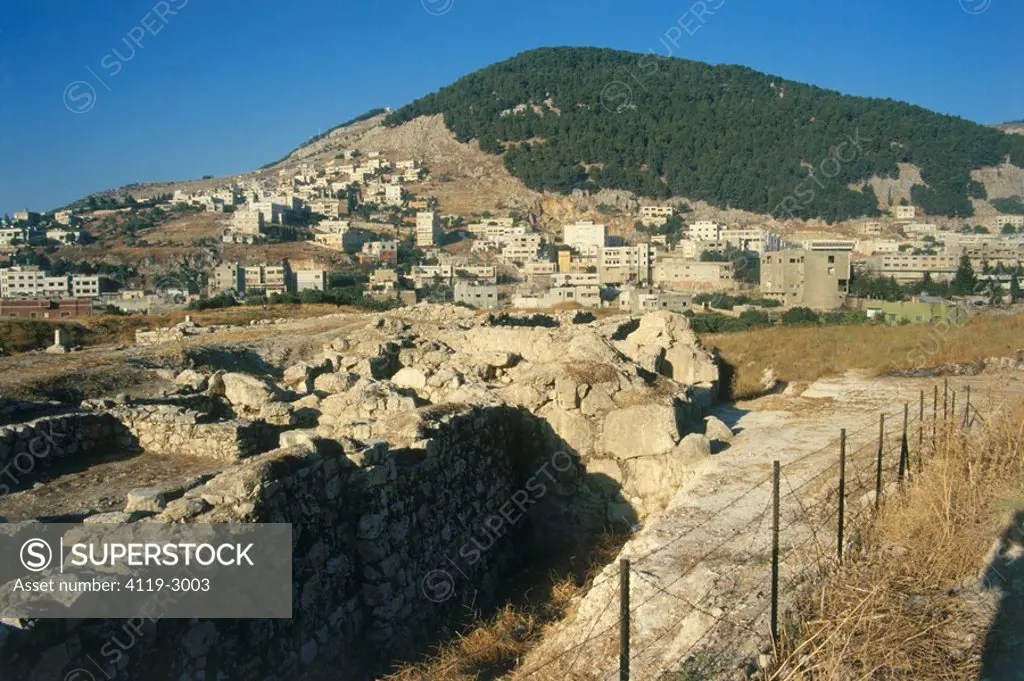 Photograph of the ruins of Tel Balata in the modern town of Nablus