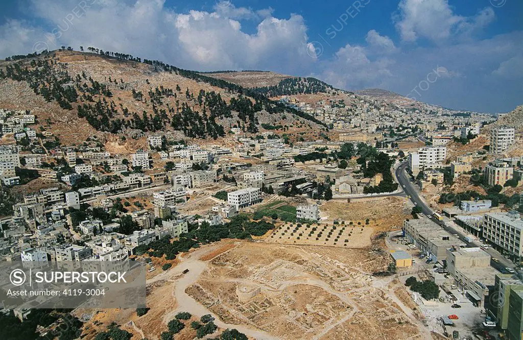 Aerial photograph of the ruins of Tel Balata in the modern town of Nablus