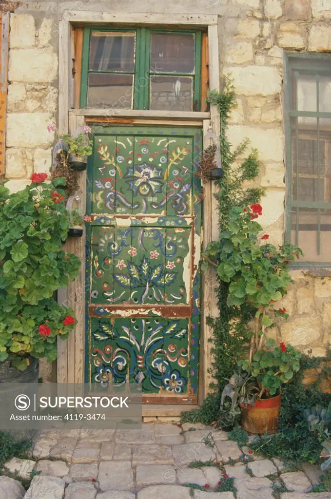 Photograph of a decorated door in an old house in the village of Rosh Pina