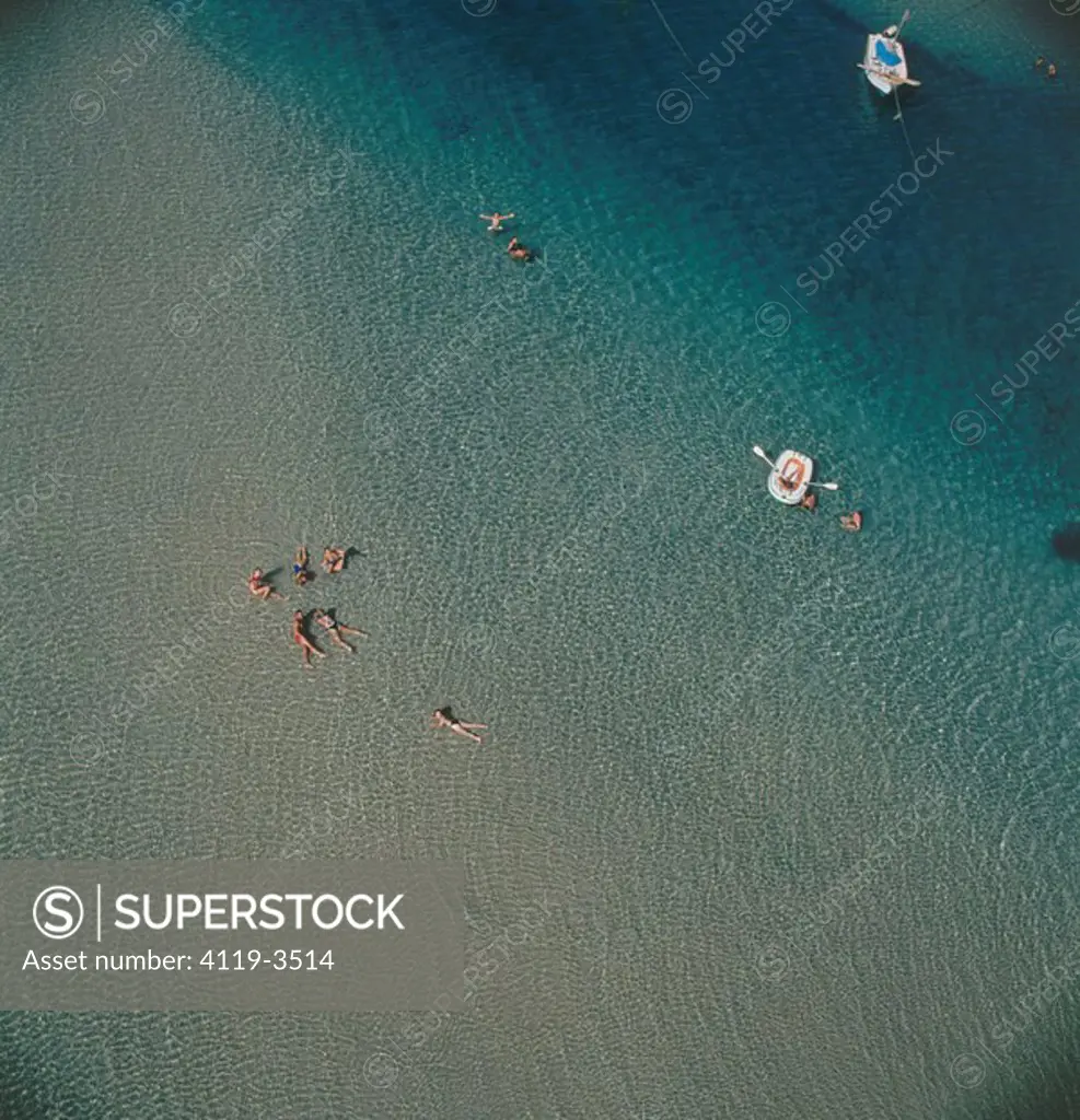Aerial photograph of people enjoying the water of the Mediterranean sea
