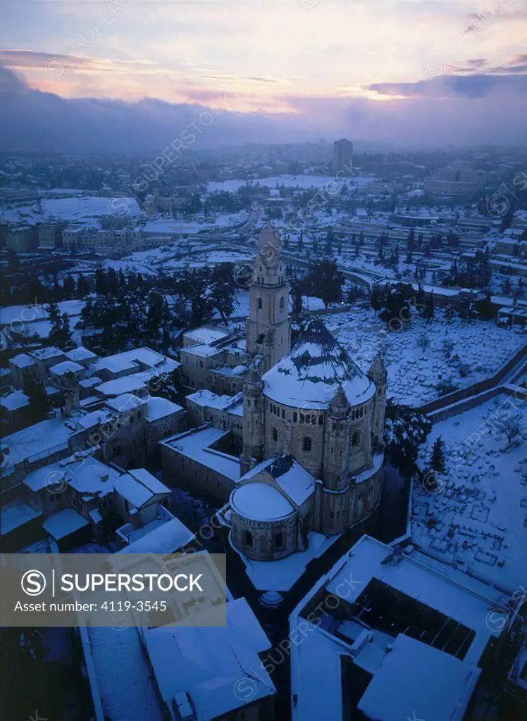 Aerial photograph of the Dormition Abbey in the old city of Jerusalem after snow strom at sunrise