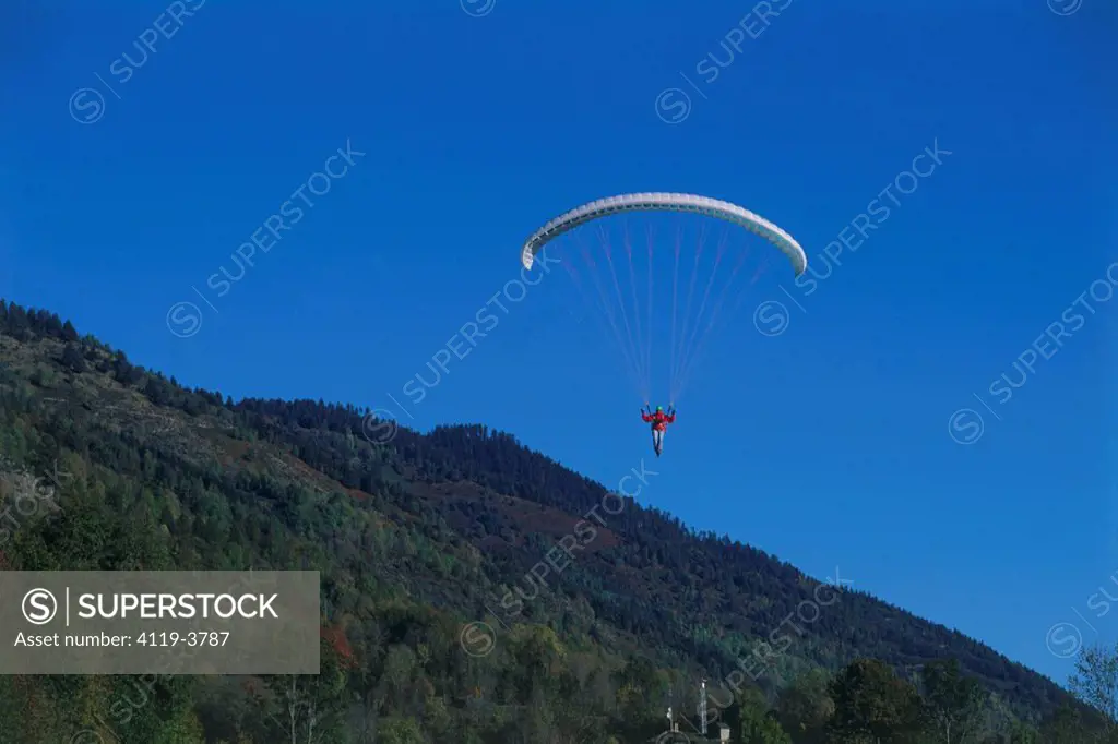 Photograph of a free_fall parachute over the mountains of France