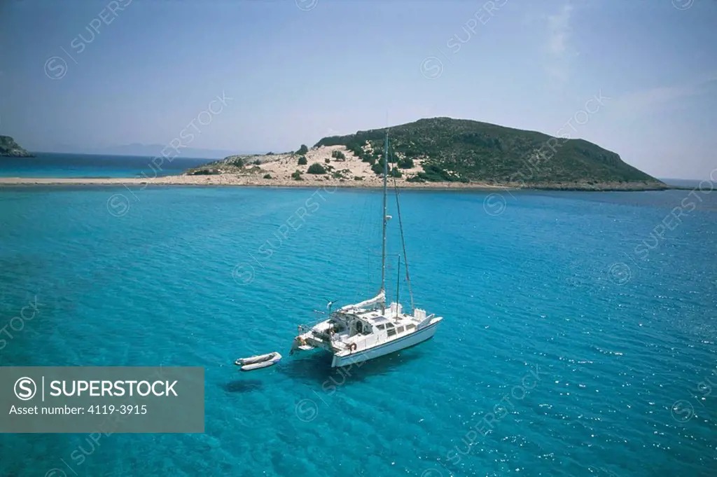 Aerial photograph of a Yacht anchor in a blue lagune of the Greek island of Elafonisos