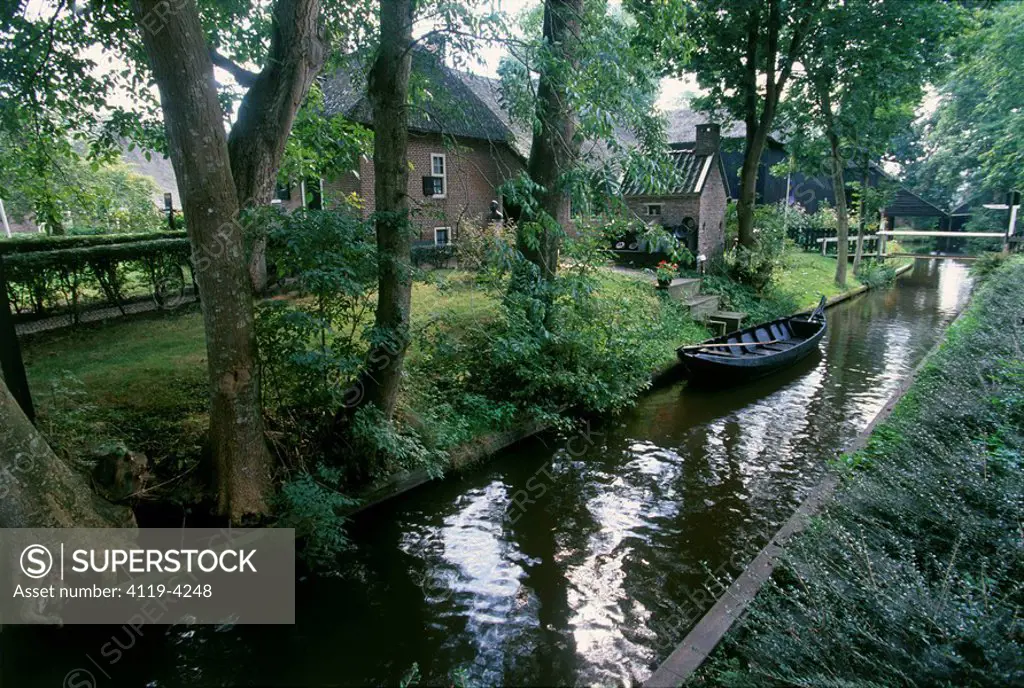Photograph of a canal near a village in Holland