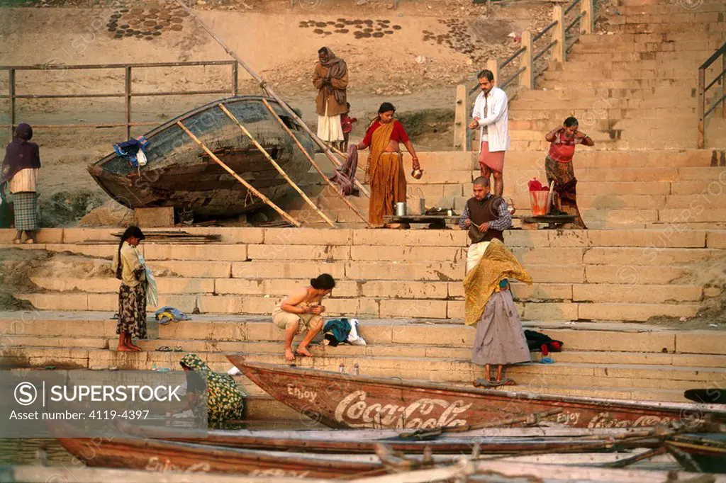Photograph of people on a river bank in India