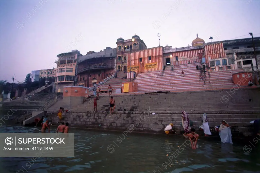 Photograph of several Indian men and women bathing in Ganges river