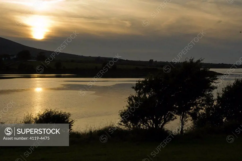 Photograph of the coastline of Ireland at sunset