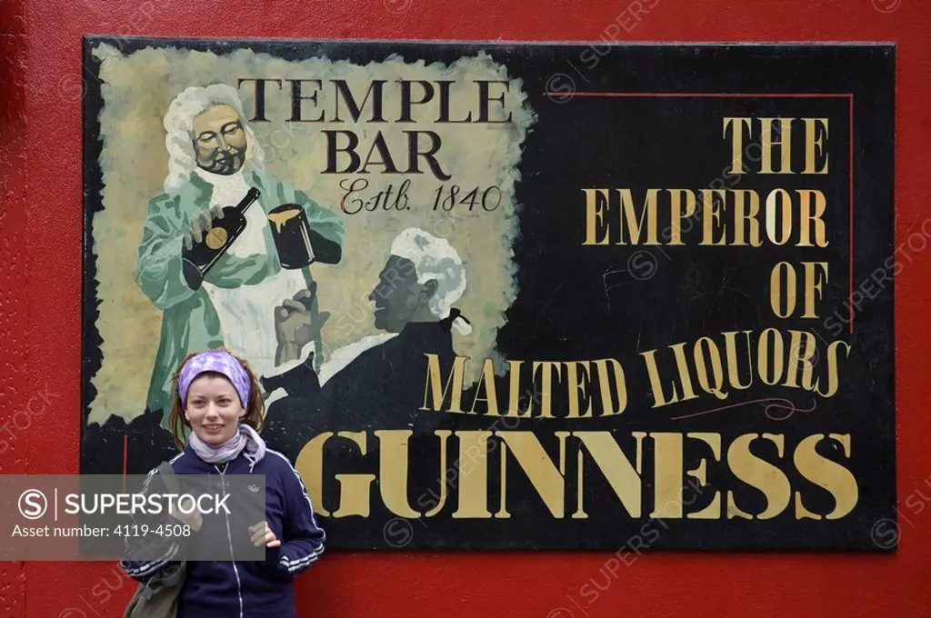 Photograph of a young woman outside an Irish pub