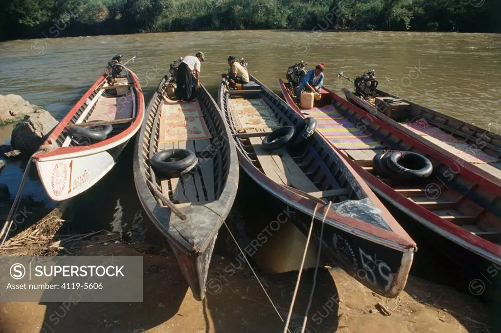 Photograph of Thai boats on a river in Thailand