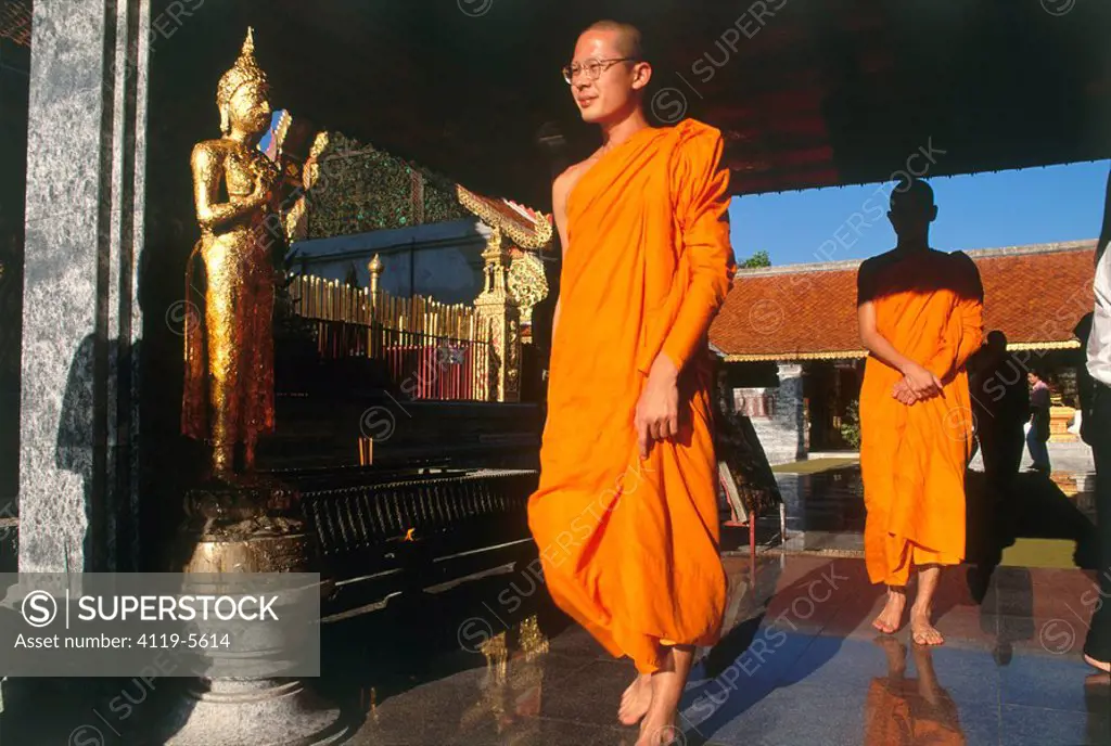 Photograph of a buddhist monks in a shrine in Thailand
