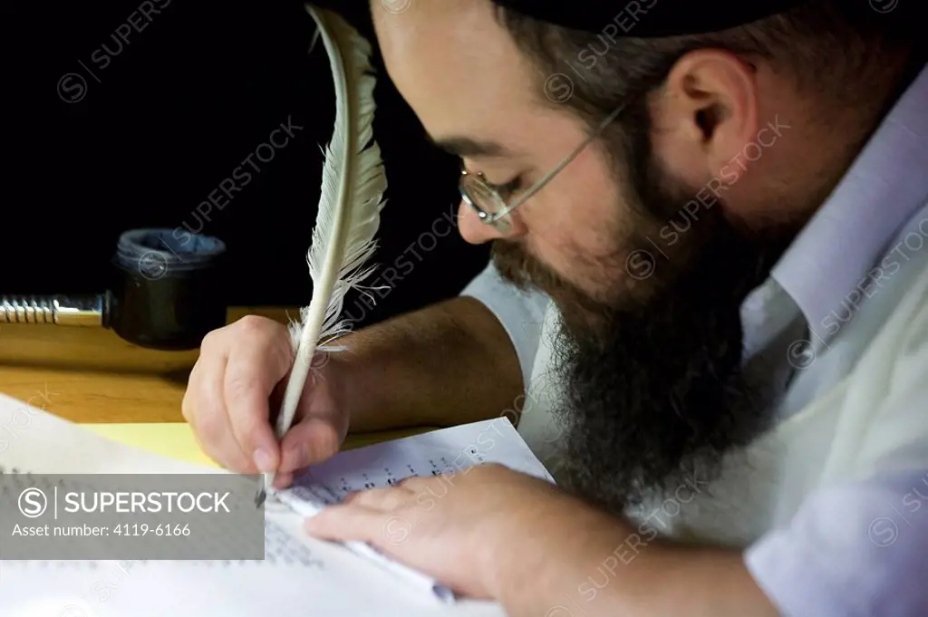 Photograph of an Orthodox Jew copying the bible _ ana ancient Jewish profession