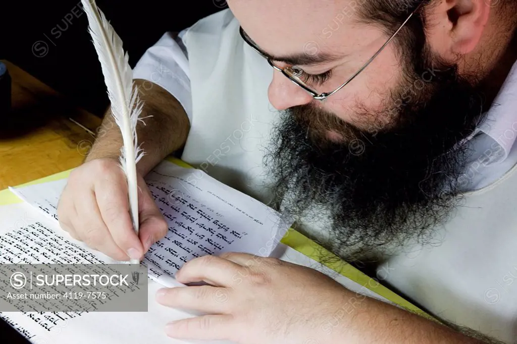 Photograph of an Orthodox Jew doing the work of copyist of the scriptures