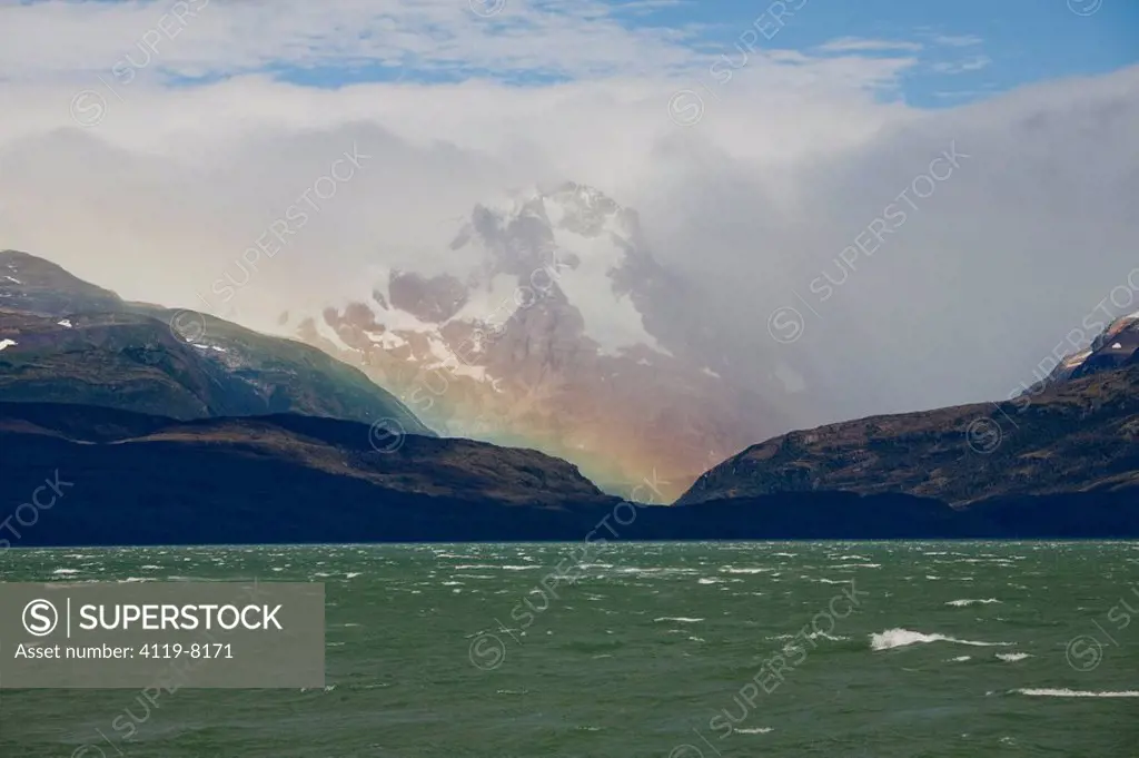 Photograph of a rainbow over the mountains of Patagonia Chile