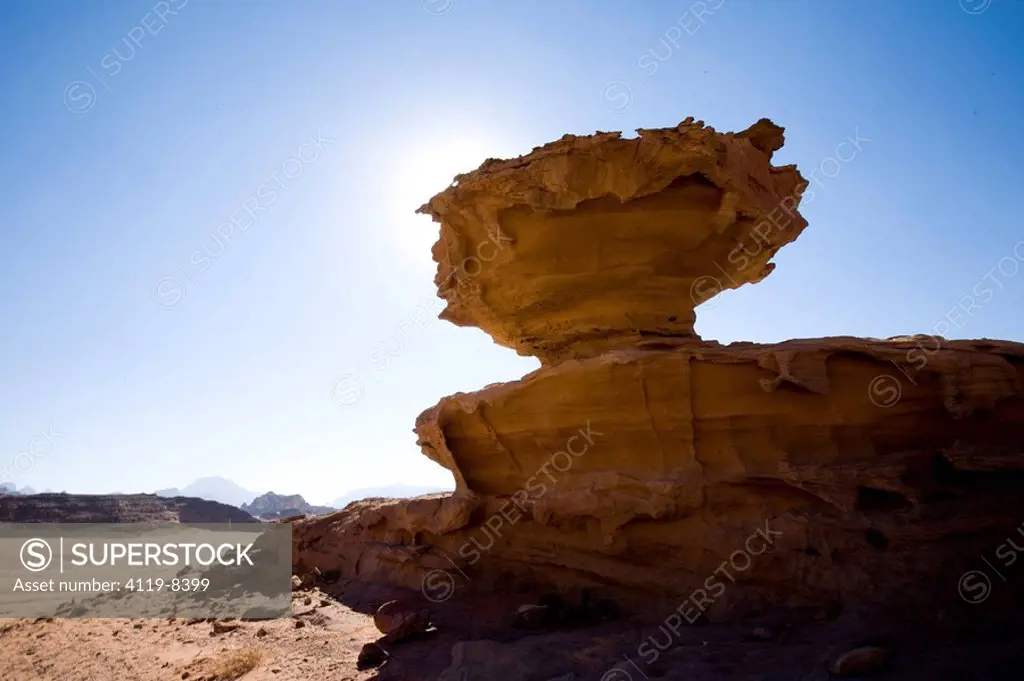 Abstract view of a a cliff shaped like a giant mushroom in the Jordanian desert