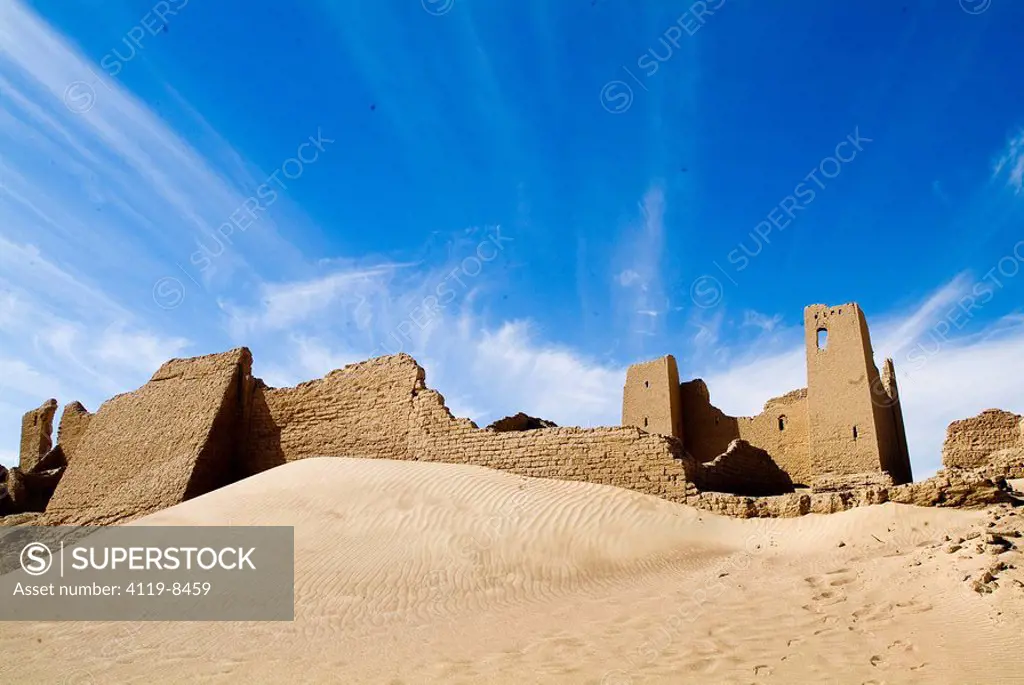 Photograph of the ruins of a castle in the sands of the western desert of Egypt