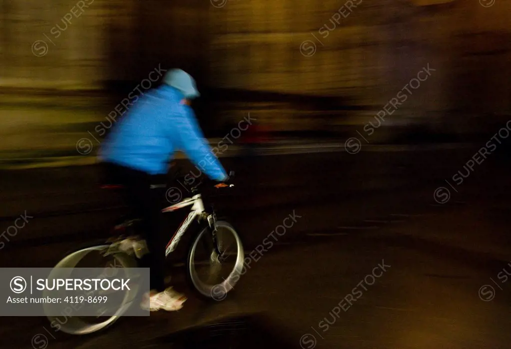 Abstract view of bicycle rider on the streets od Seville Andalusia
