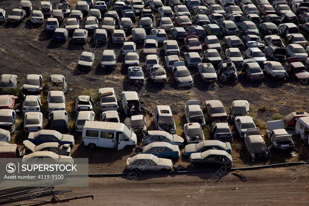 Aerial photo of ruined cars in a parking lot in the North Negev