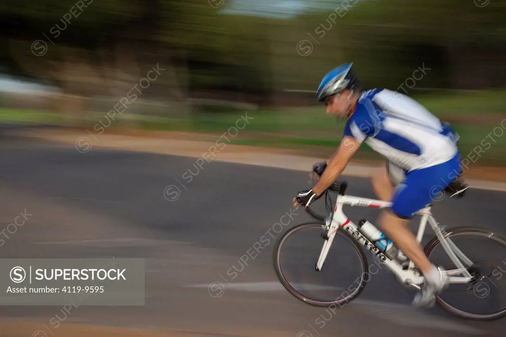 Photograph of a bicycle rider in the Yarkon Park _ the green lungs of the city of Tel Aviv
