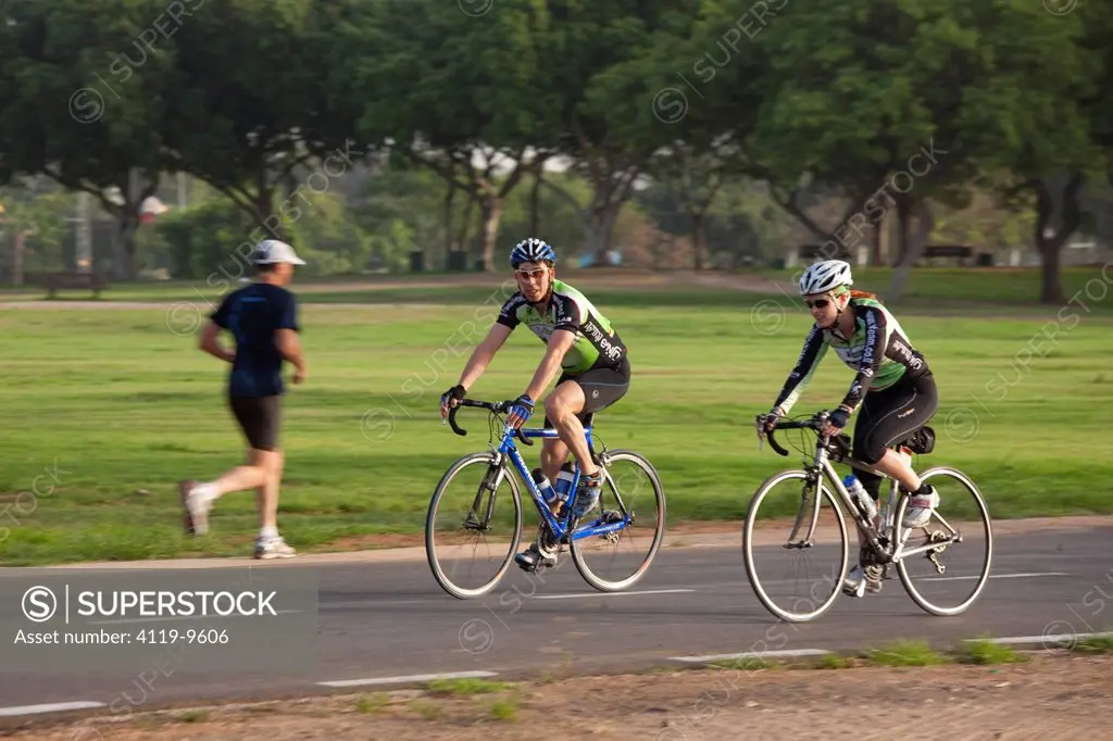 Photograph of a bicycle riders in the Yarkon Park _ the green lungs of the city of Tel Aviv