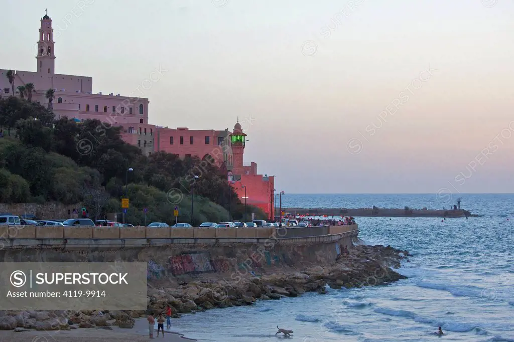 Photograph of the old city of Jaffa with pink light upon it