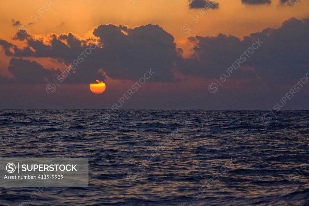Photograph of the sun setting over the Mediterranean sea