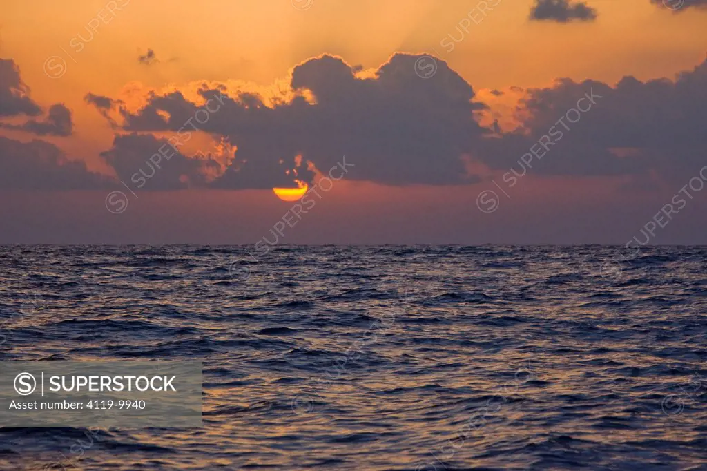 Photograph of the sun setting over the Mediterranean sea