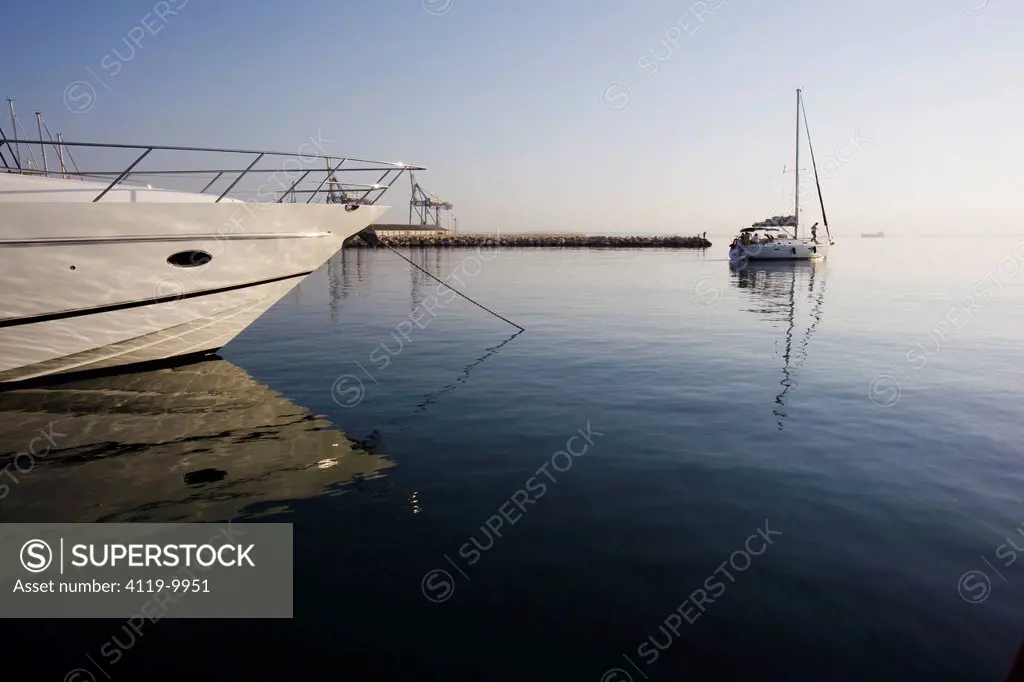 Photograph of a sailing boat in a port