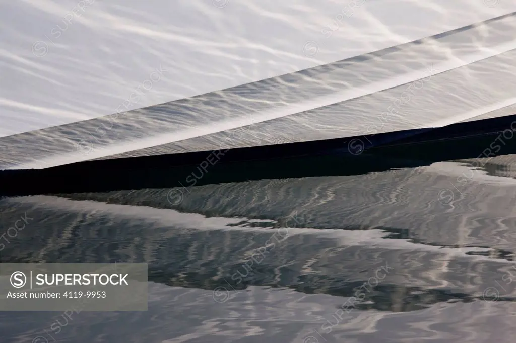Abstract photograph of the reflection of a boat in the water