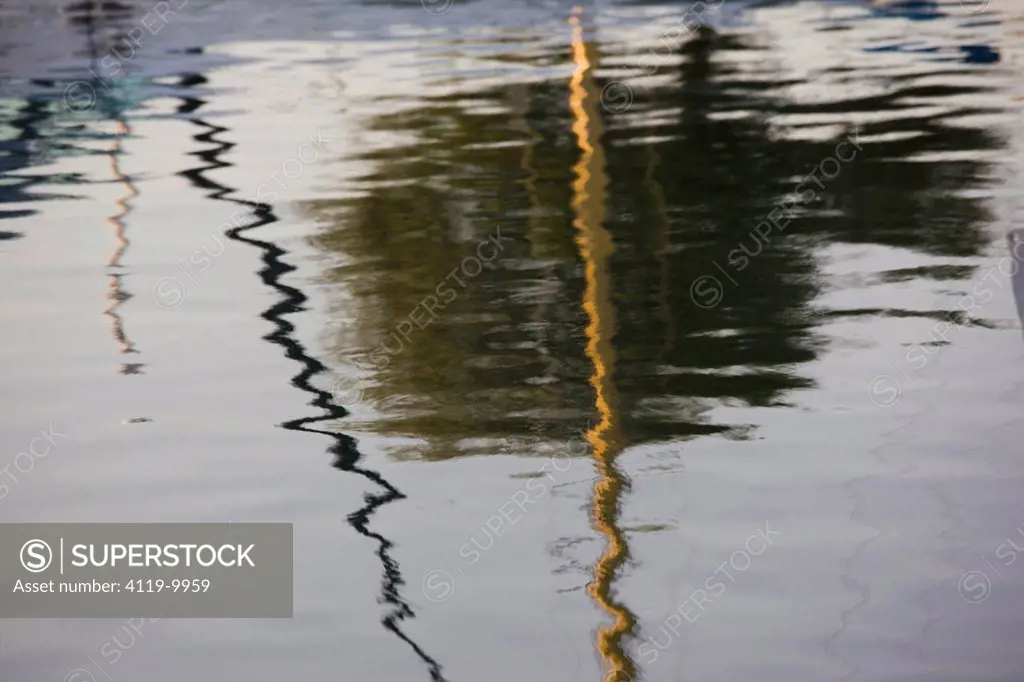 Abstract photograph of the reflection of the boats in a marina in Cyprus