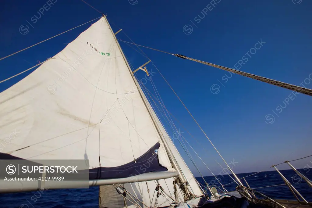 Photograph of a sail boat cruising on the Mediterranean sea