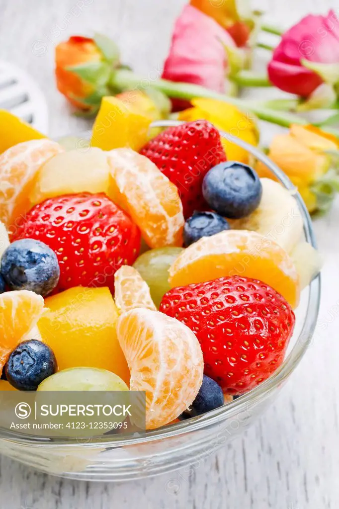 Fruit salad in glass bowl. Healthy dessert