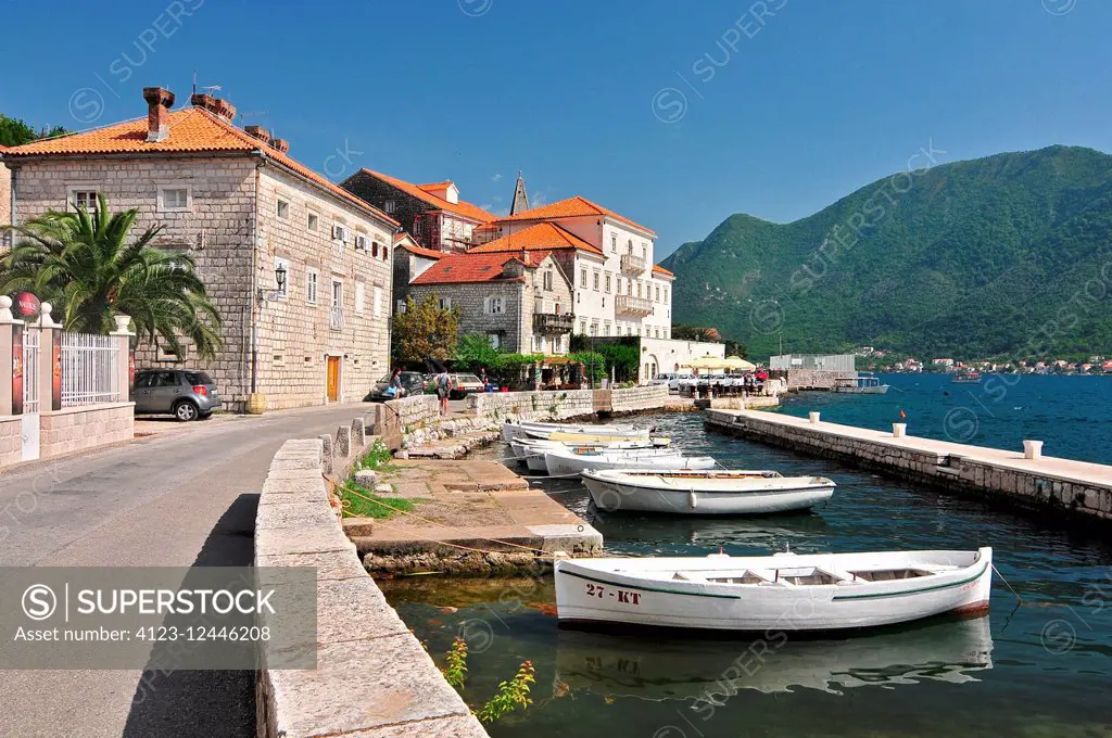 Fishing boats float moored in Perast town. Kotor Bay Montenegro.