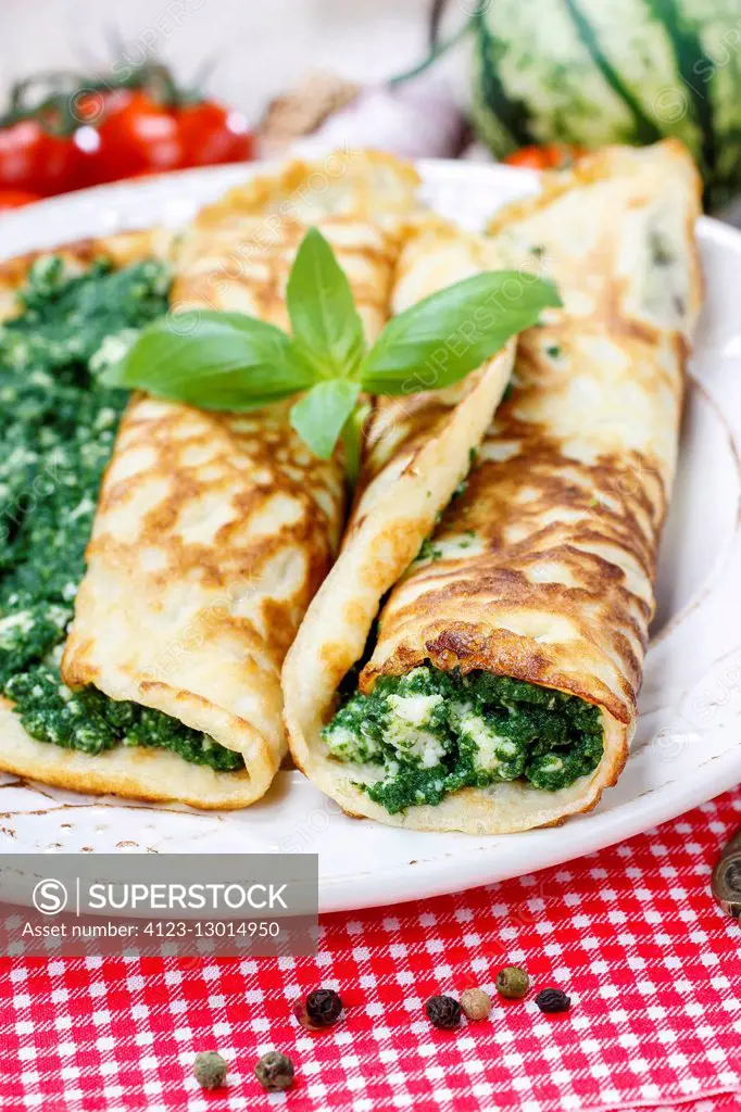 Mediterranean cuisine: crepes stuffed with cheese and spinach. Healthy food
