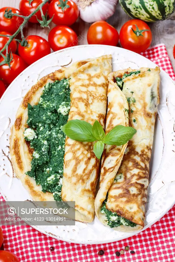 Mediterranean cuisine: crepes stuffed with cheese and spinach. Healthy food