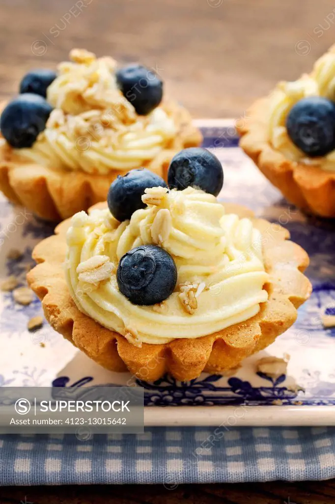 Cupcakes with vanilla cream and blueberries. Party dessert