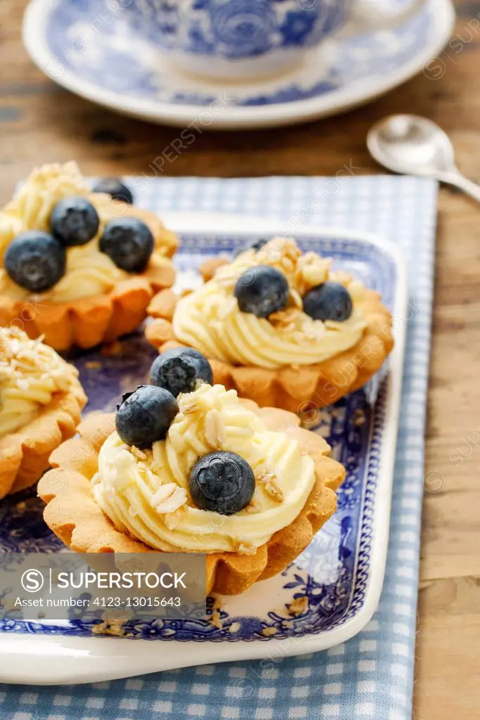 Cupcakes with vanilla cream and blueberries. Party dessert