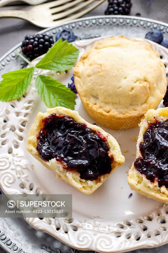 Muffins filled with blueberry and blackberry jam. Party dessert