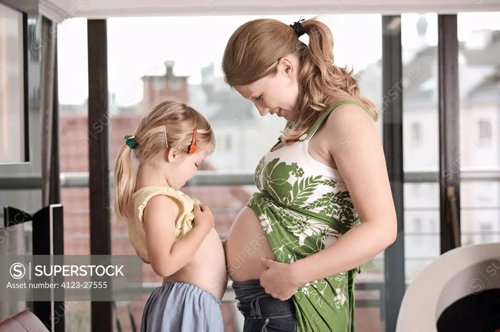 Daughter with her pregnant mother