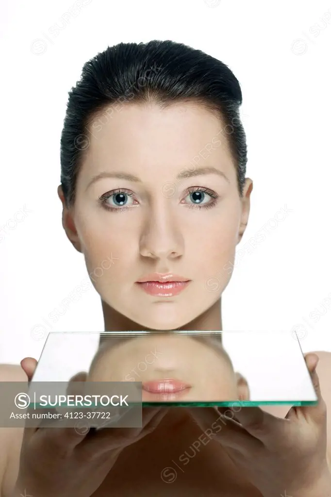 Woman holding a mirror.