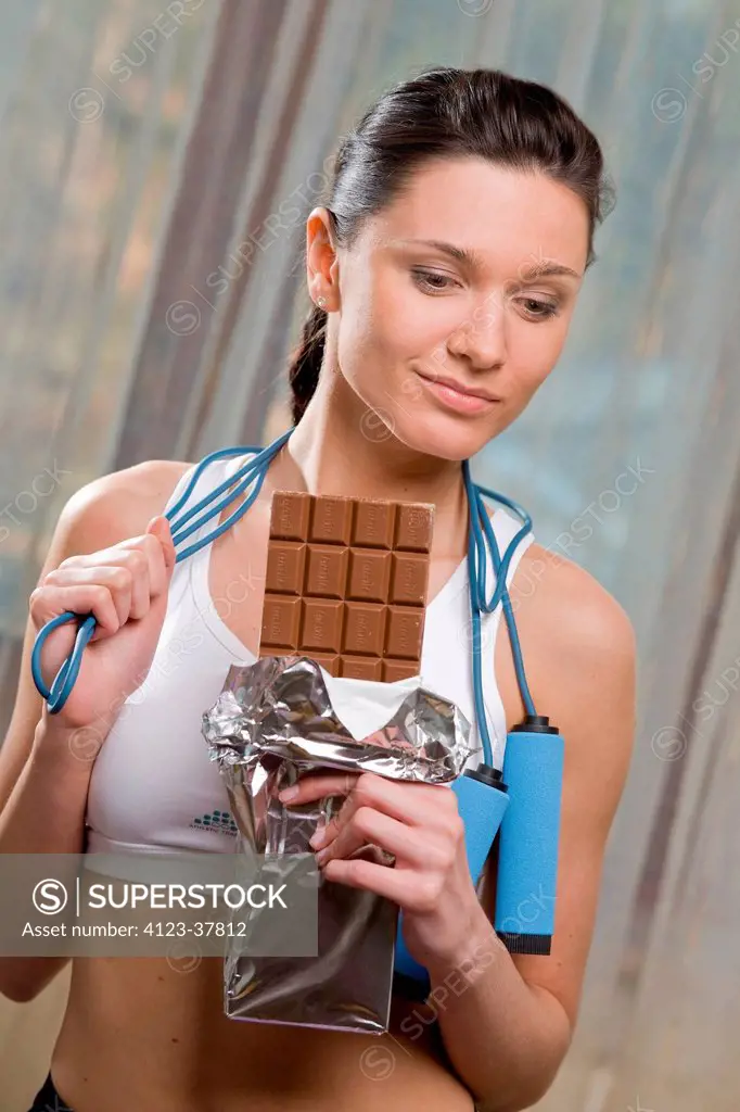 Woman chocolate during exercises.