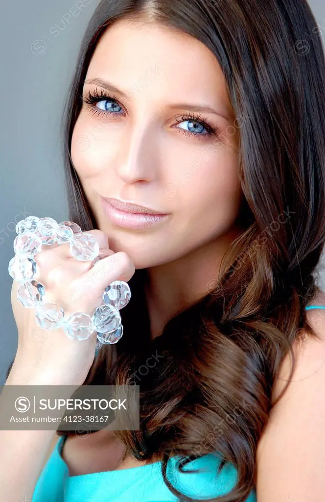 Young woman portrait with jewellery.