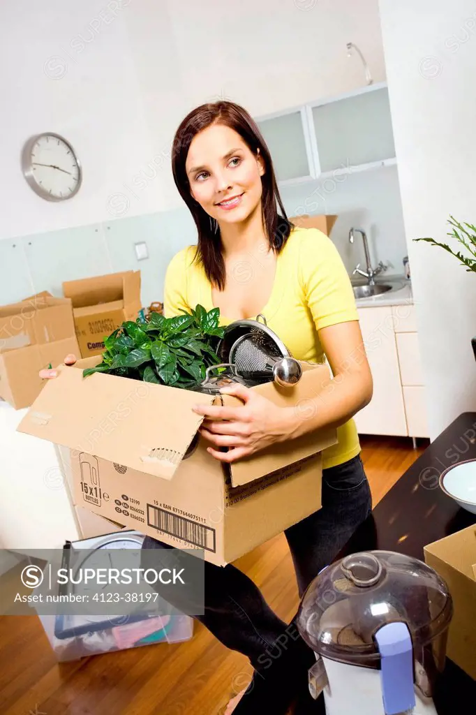 Woman packing equipment needed in the kitchen.
