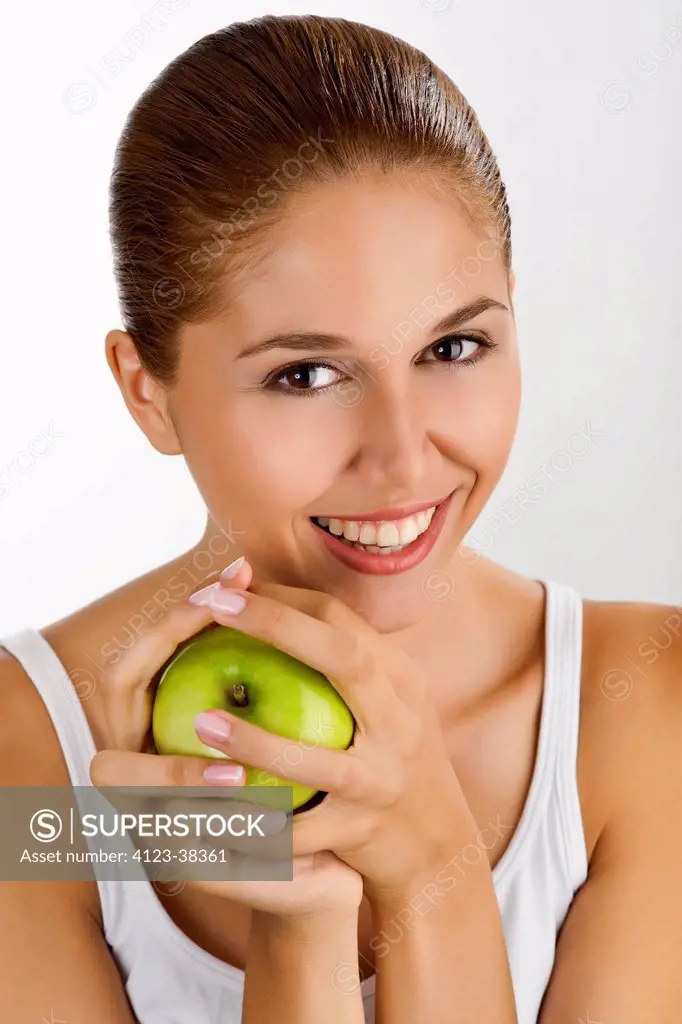 Woman holding apple.