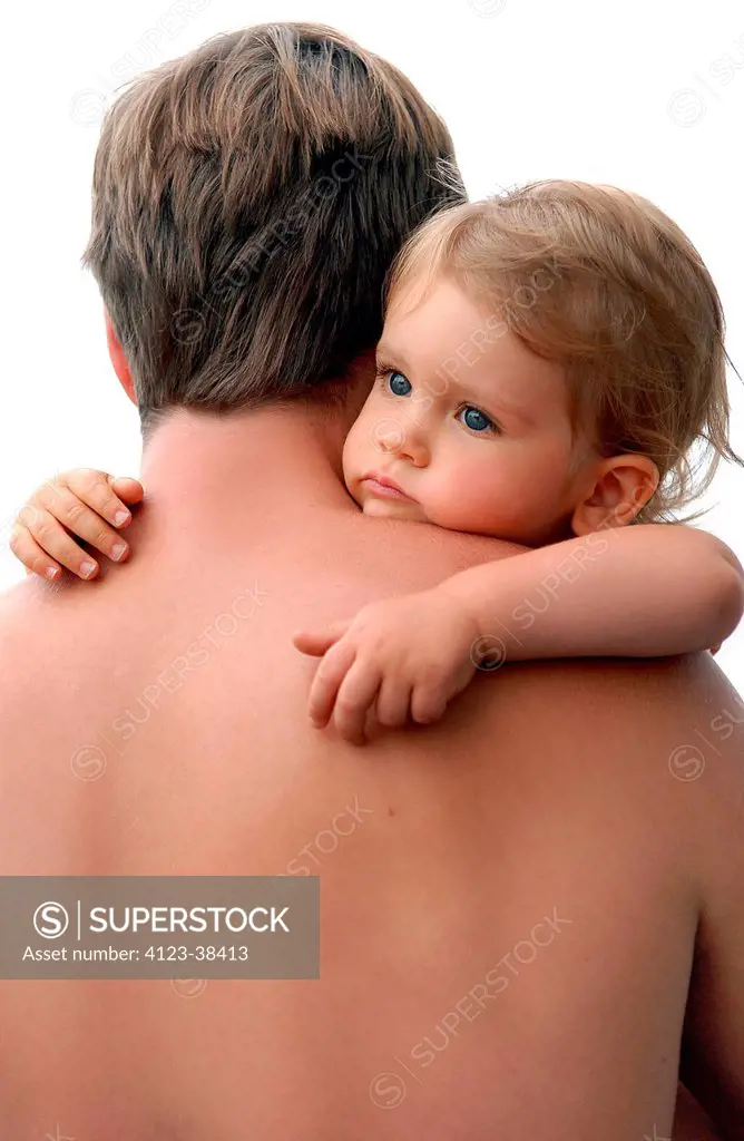 Man holding child in his arms.